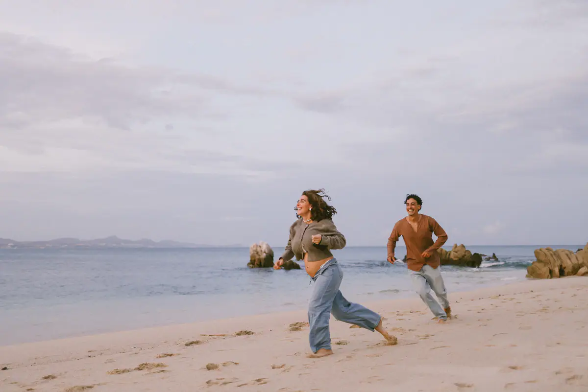 Both running toward the sea at the end of the session